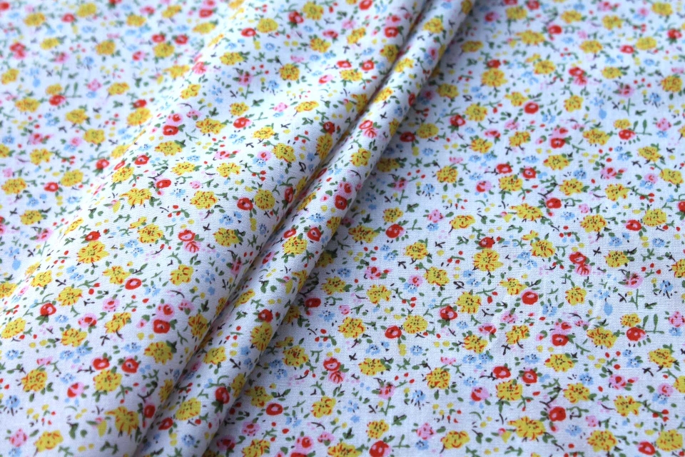 Printed Cotton Lawn - Yellow, Orange and Pale Blue on Off White